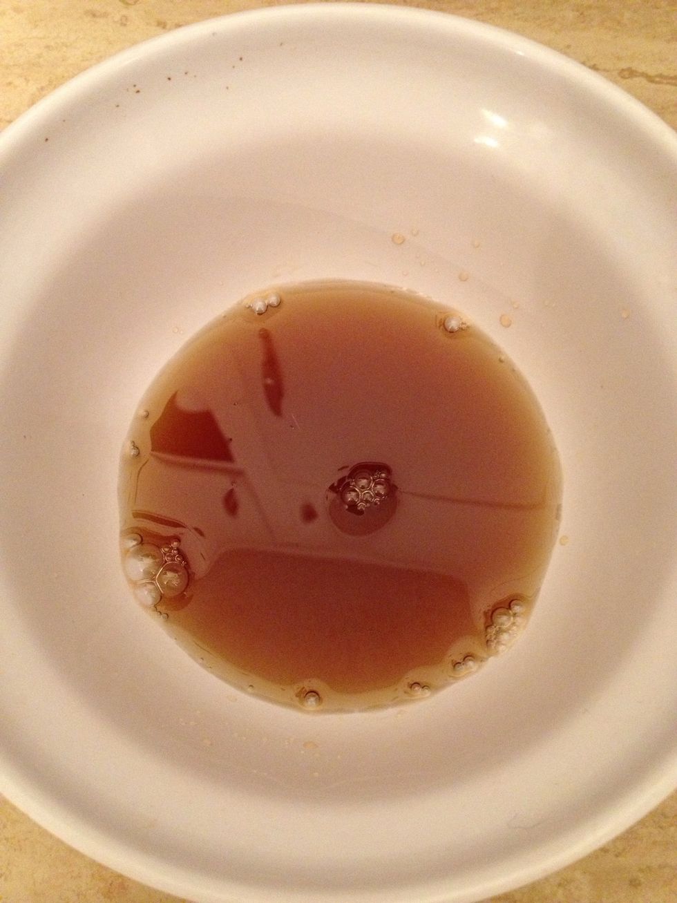 To make the nuoc cham (sweet fish sauce dip)-Pour some fish sauce in a bowl. About 1/4 cup.