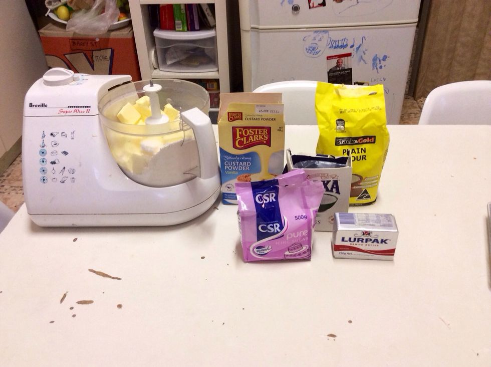 To make the pastry place 3 cups of plain flour, 1/3 of a cup of custard powder, 1 cup of icing sugar and a pinch of salt in a processor. Add butter and process until the mixture resembles breadcrumbs.