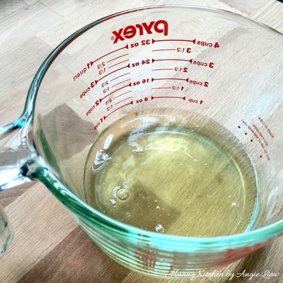 To make the pudding, first pour the egg whites into a large measuring cup or container.
