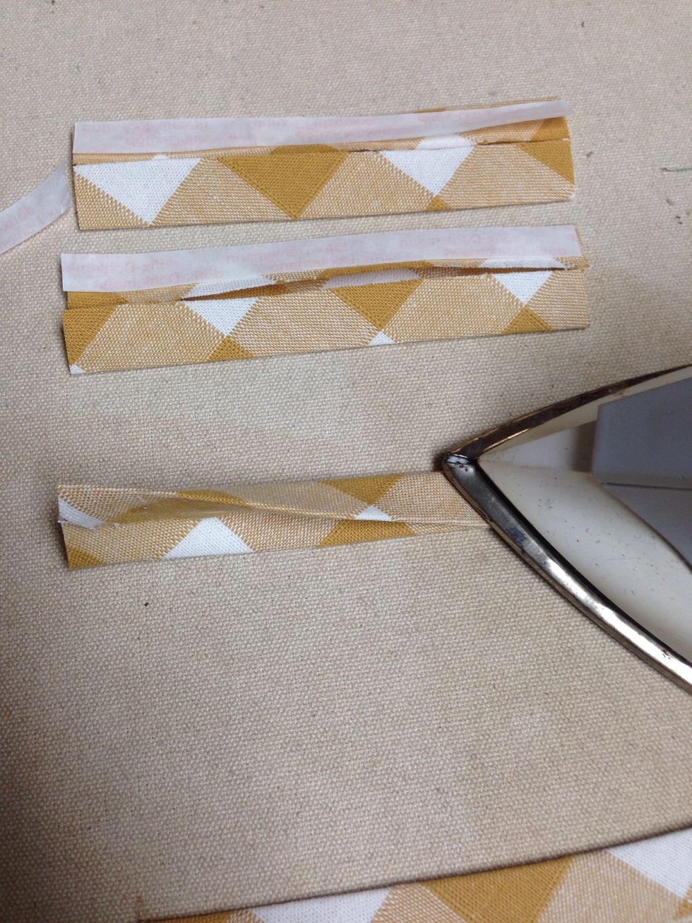 To make the tabs simply apply the Steam-A-Seam-II to one side then remove the paper, fold in half again and press.