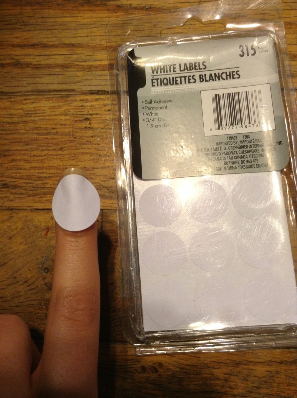 To make the tip add the label sticker to the nail leaving an area at the end. (Make sure the previous layer of nail polish is dry before this step)