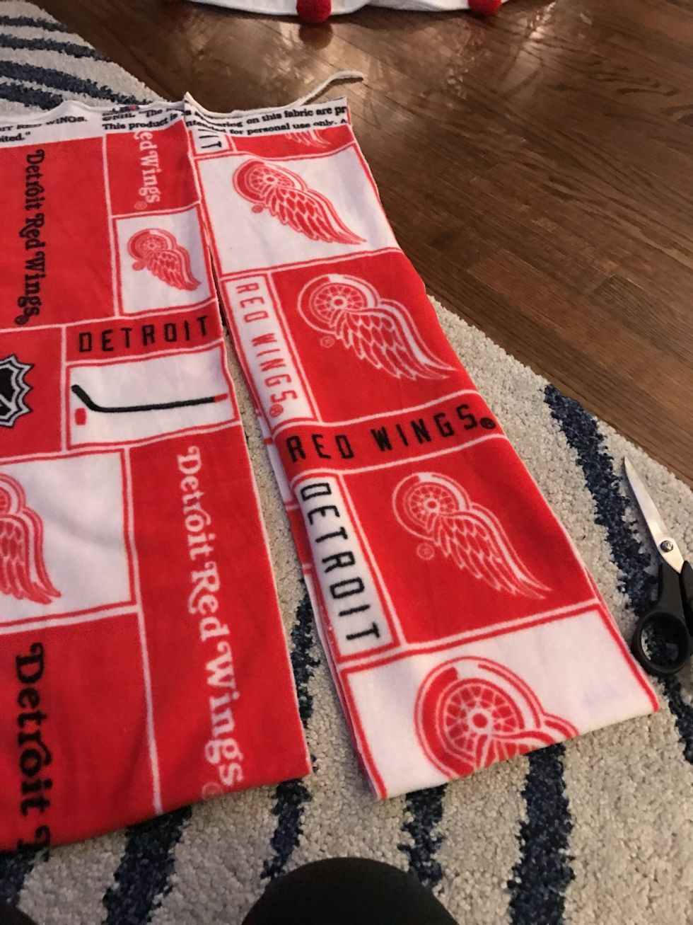 To make the top and bottom border, cut 2 even strips (about 6" wide) from the top of the fleece.