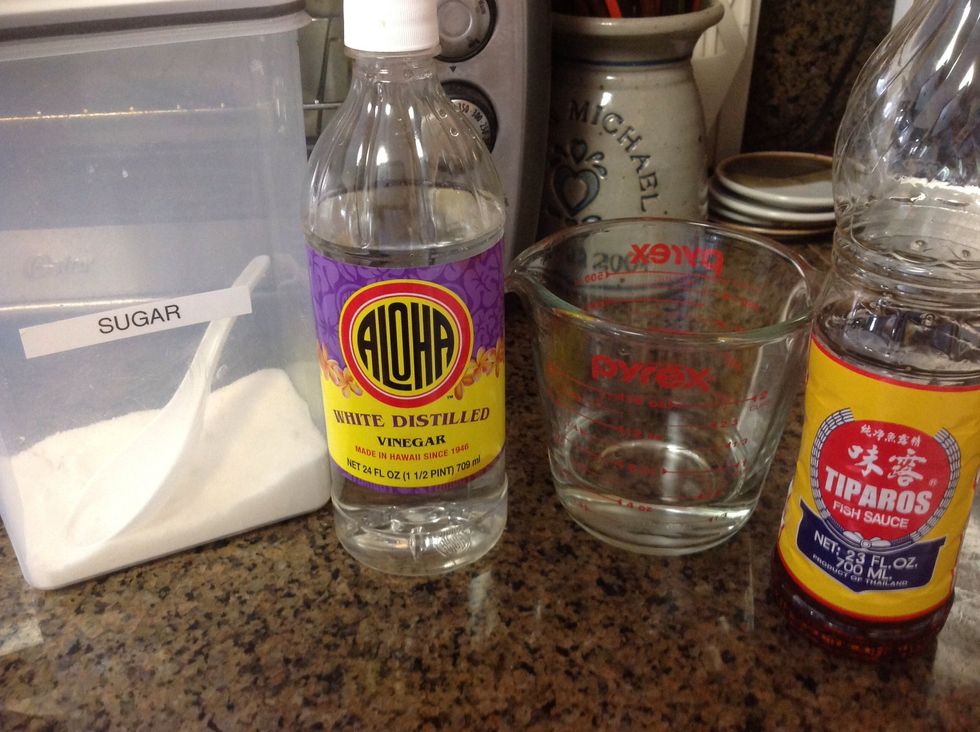 To make the Vietnamese fish dipping sauce:   Bring 1/2 cup water to boil.  Add 1/2 cup each of vinegar, fish sauce, and sugar. Heat until sugar is dissolved. Set aside and cool.