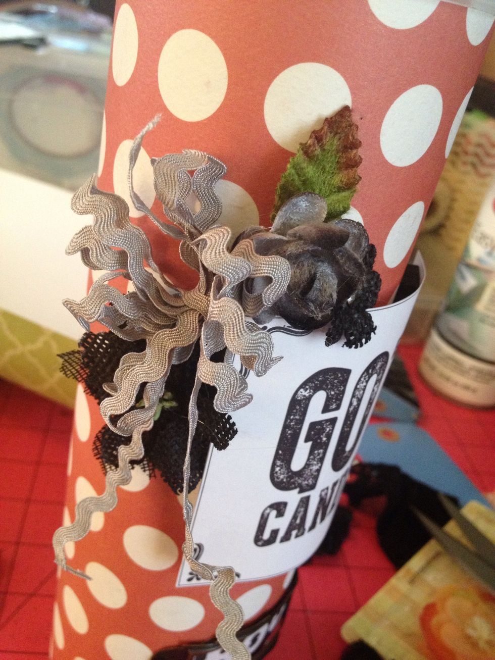 to make this accent I wrapped the ric rac around # fingers and used about 6 inches to tie it off in the middle. Then just poofed it out