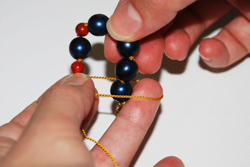 To make your last knot, create a final loop and pull your entire finished piece through that loop.