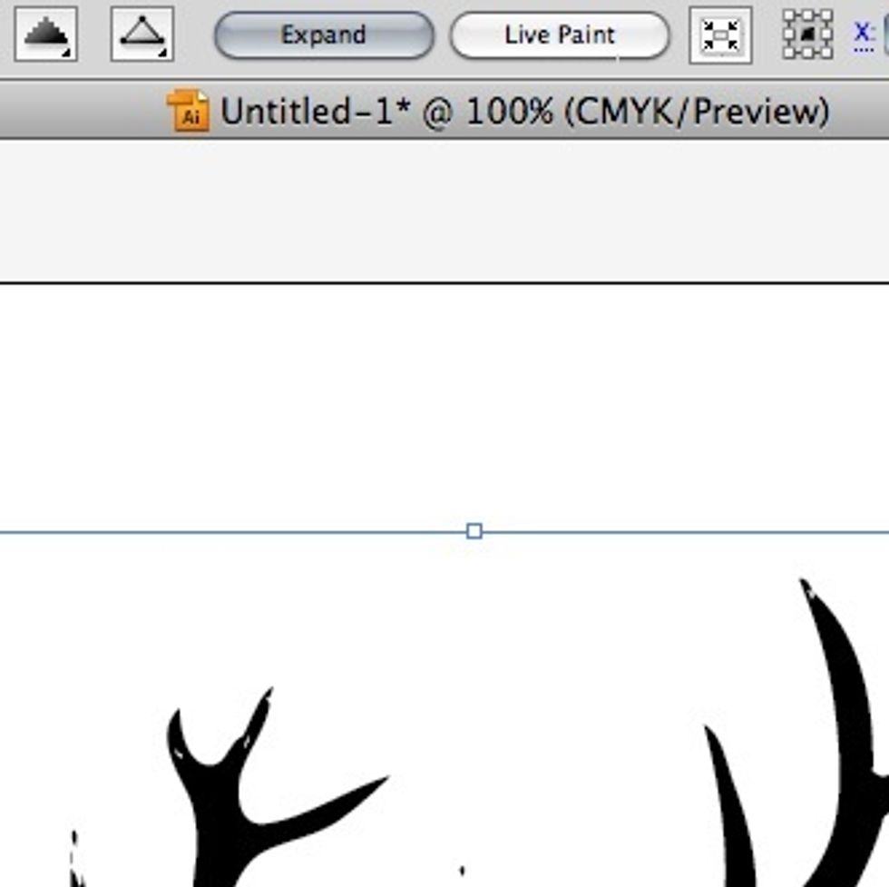To make your live trace image editable we need to separate the white from the black. Select the image and click on the "Expand" button at the top of your screen.