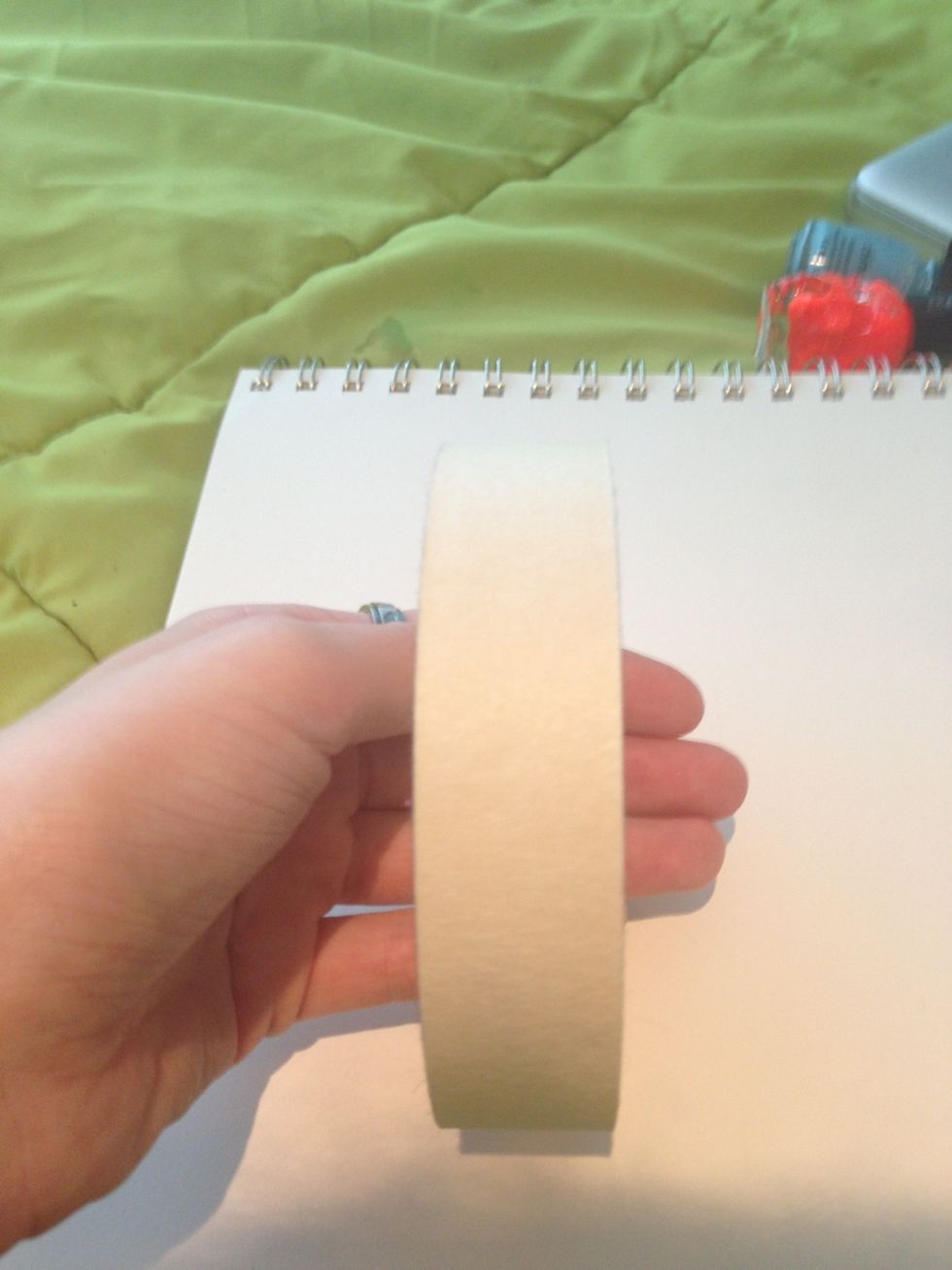 To make your striping tape you will need some tape. I am using painters tape but you can use any tape that you have on hand. However the wider the tape is the longer your tape will be.