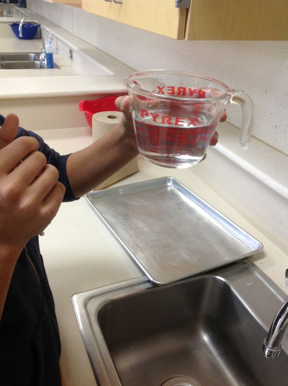 To measure water or other liquids, pour the correct amount of water into a standardized measuring cup.