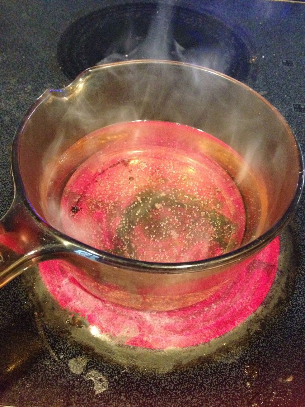 To melt the candy bark, start by bringing water to a boil