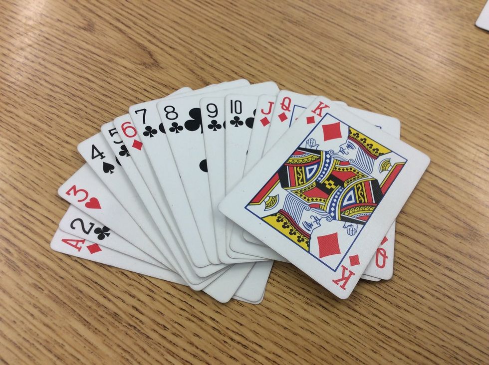 To play each person has to put down cards from Ace to King