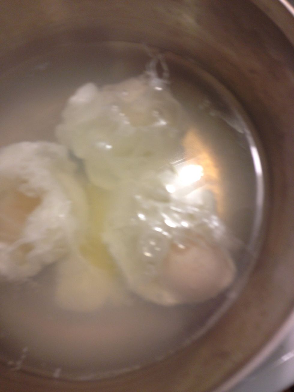 To poach eggs bring water and vinegar to boil, add eggs, first crack them into a bowl and add to water, don't crack into water, they will break Once in remove from heat, cover and let cook 4-5 minutes