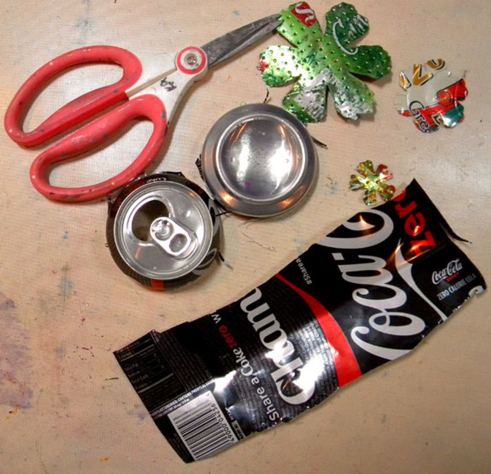 To prepare the can to die-cut, cut the top and bottom off of the can, then slice down the side so that it lays flat. Be careful because the edges are very sharp! I used the silver side of the can.