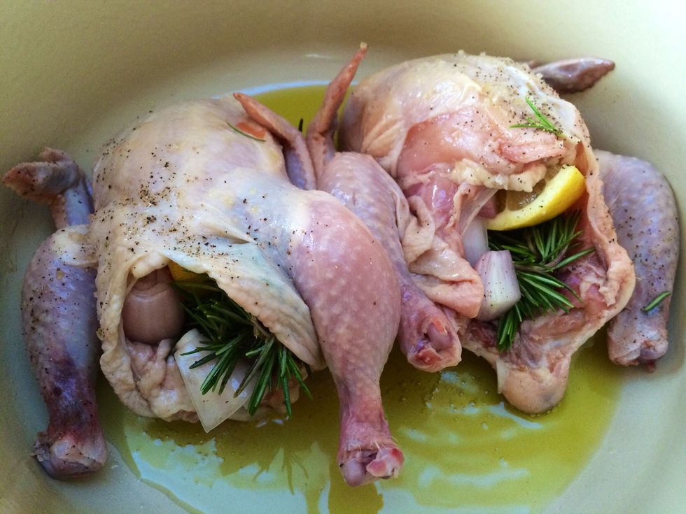To prepare the cornish hen stuffing slice lemon in two halves, quarter one of the halves then stuff the cornish hen, quarter the shallots and add it to stuffing including with the rosemary.