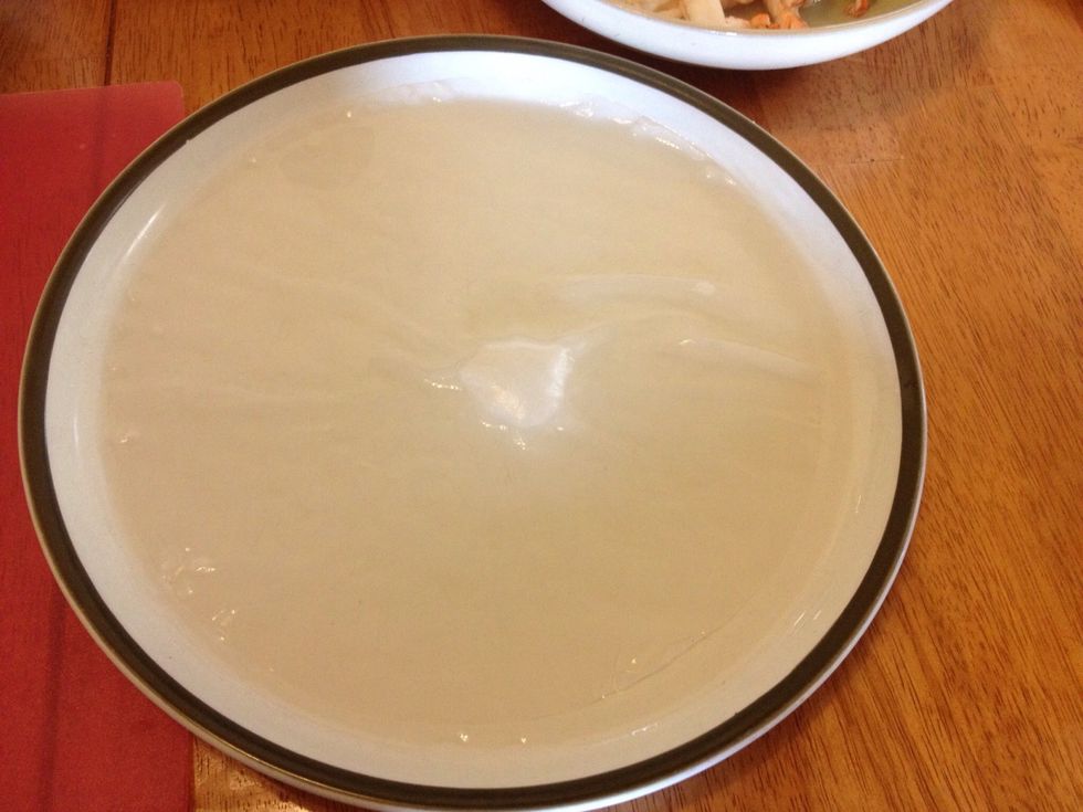 To prepare the rice paper noodles, soak in warm water 1 wrapper at at time. Submerge until wrapper is soft and pliable, about 1 minute.