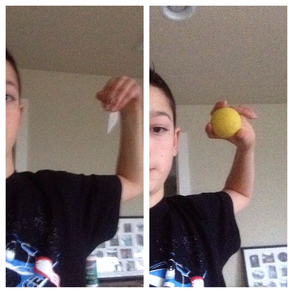 To prepare to throw it, hold it like you would with a baseball.