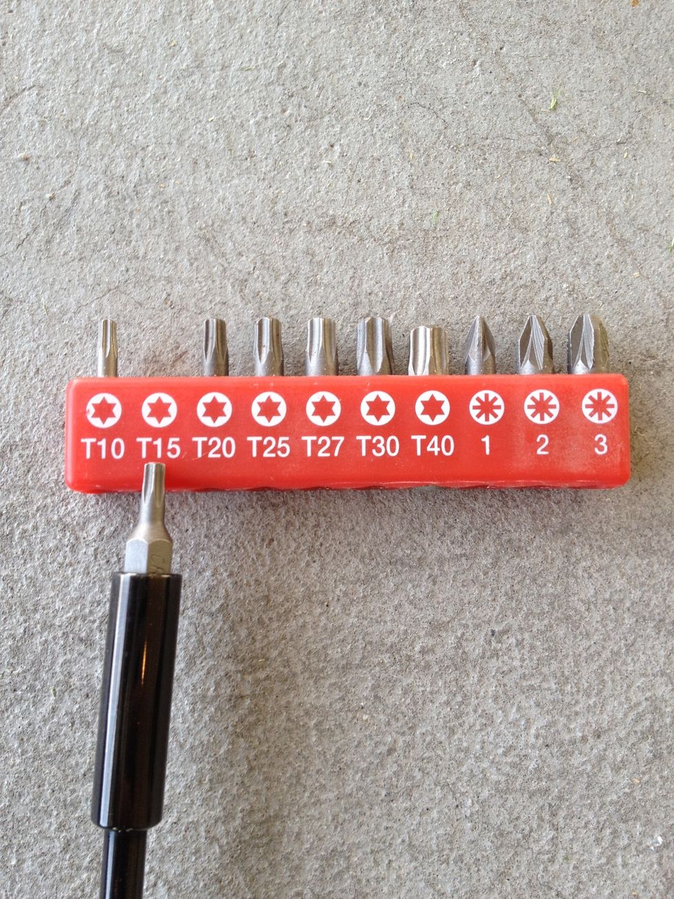 To proceed you must arm yourself with one of these crazy tools. I'm using a T15 top.