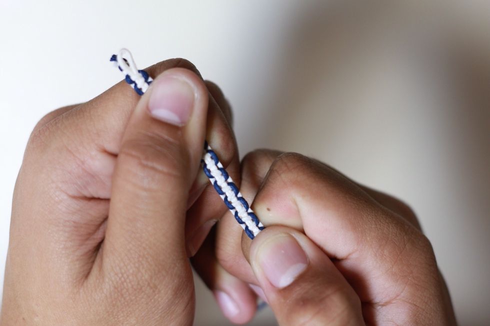 To quicken the process. Pull the cord apart like so in the picture. So it can cover more cord and make the process faster.