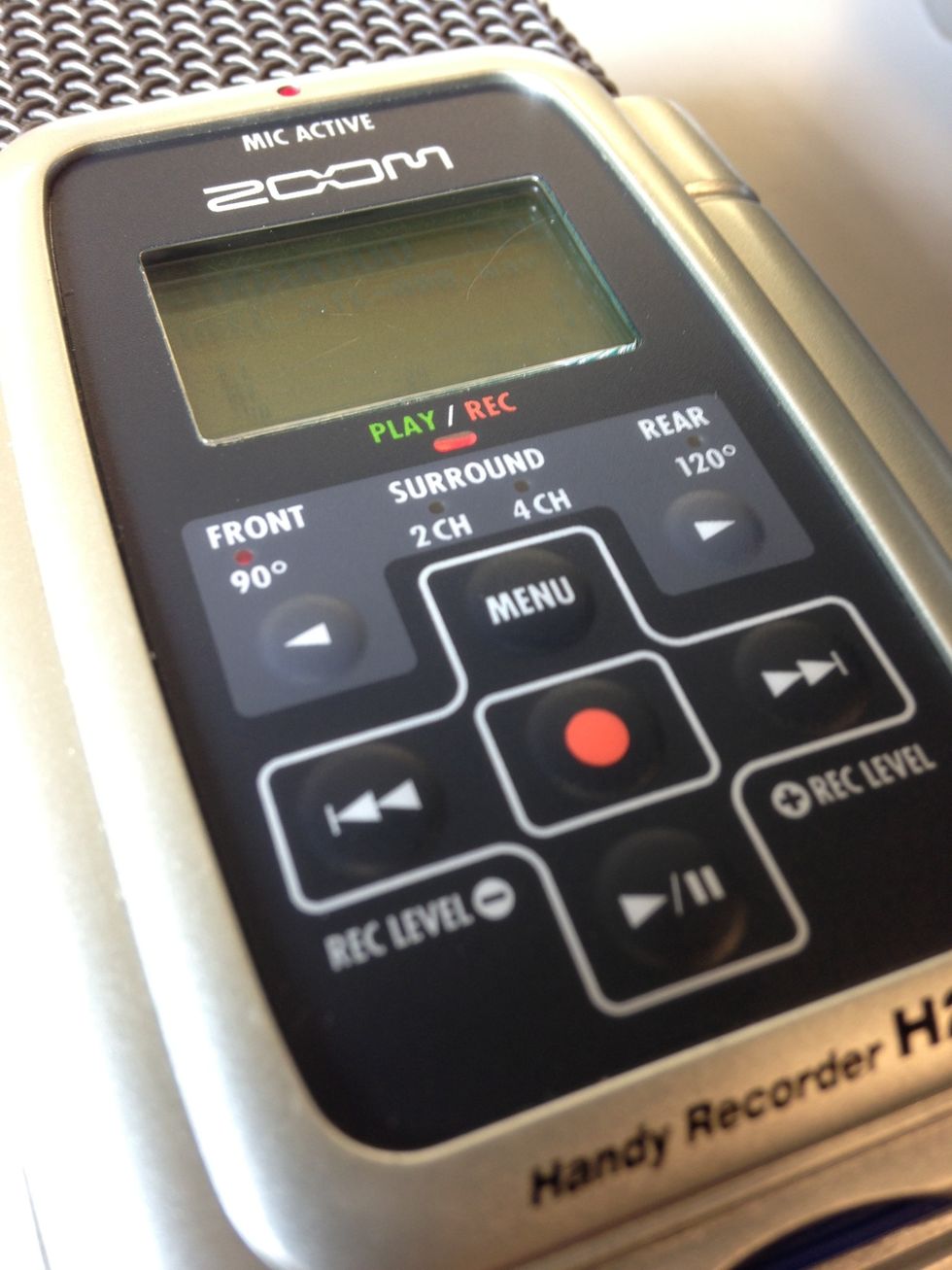 To record, hit the red Record button a second time. There will be a solid red light while recording. Hit the Record button again to stop recording.