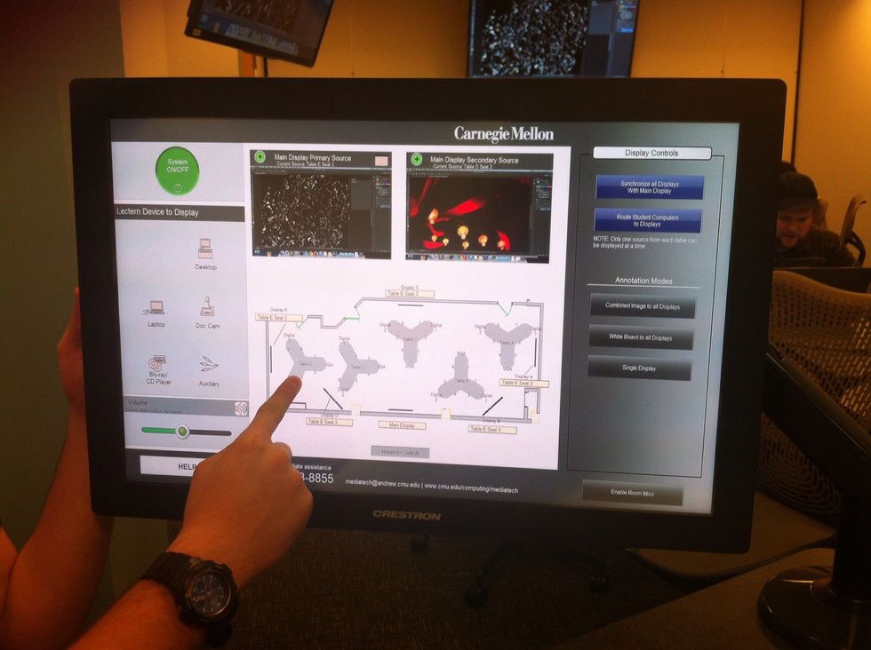 To set the primary and secondary displays, tap on the source screen and then a select a student's seat. In this example, the student chosen as the secondary source is sitting at Table E Seat 3.