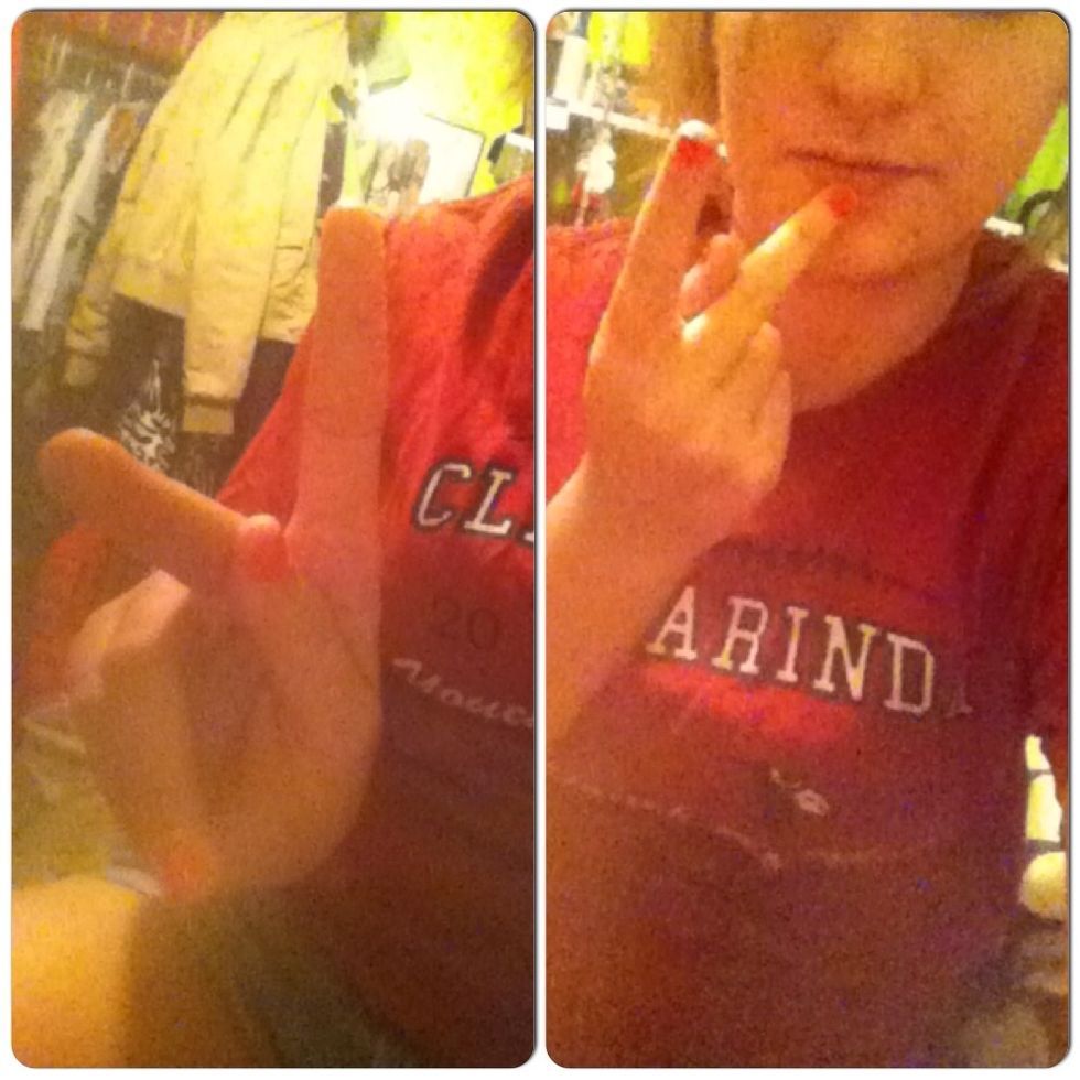 To sign "pink," make the letter "K," (left photo), touch your middle finger to your chin, (right photo), & swipe down twice.