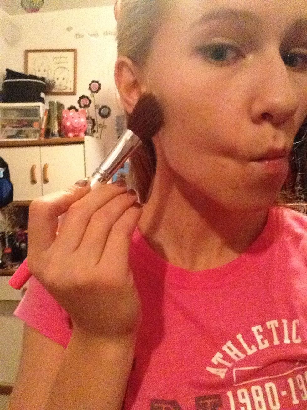 To start contouring suck in your cheeks, that is where you want to start with the dark bronzer.