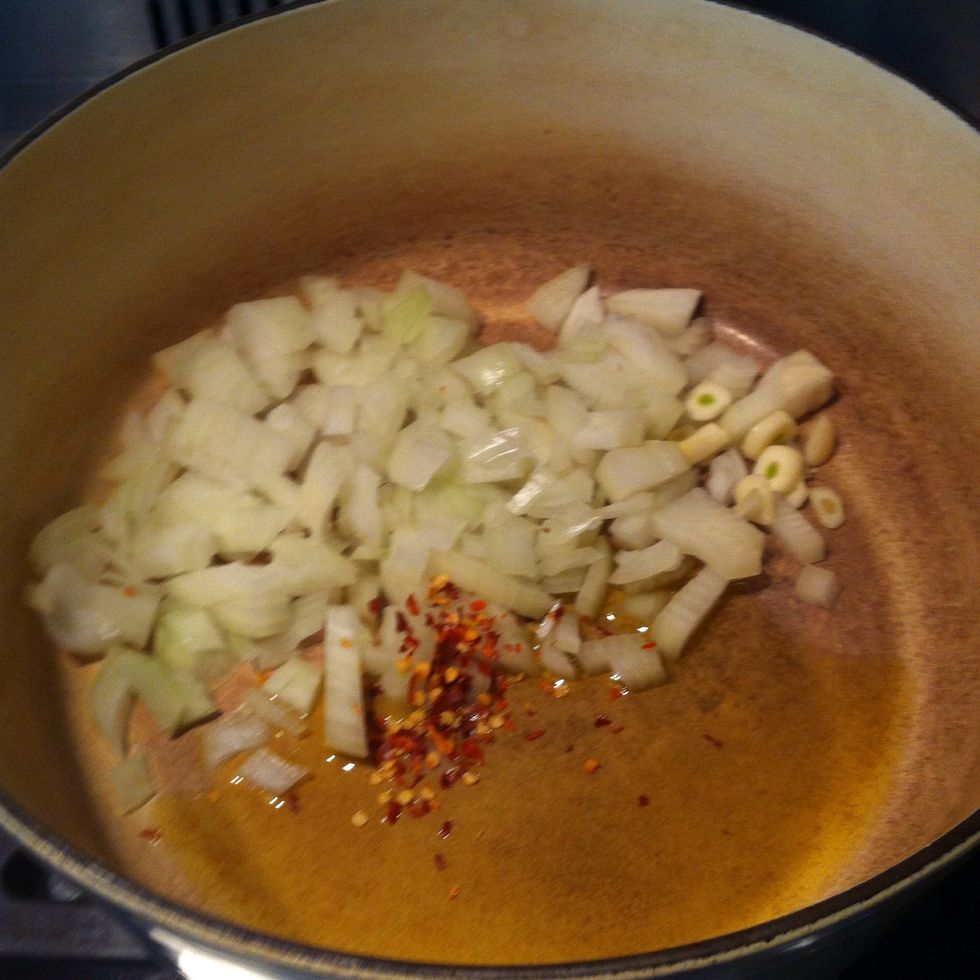To start cooking place a couple of glugs of oil, onion, garlic and chilli in a large saucepan and cook for 10 minutes or until soft but not coloured.