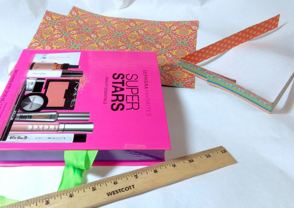 To start off, I picked out my papers and took some measurements. Nothing had to be perfect, since I decided to embrace the colors present in the box and let the edges show.