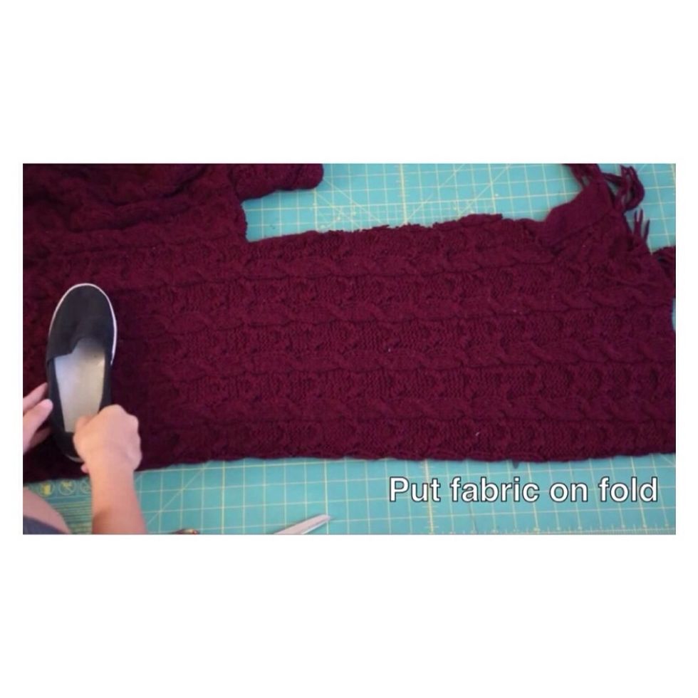 To start off put the piece of fabric on the table