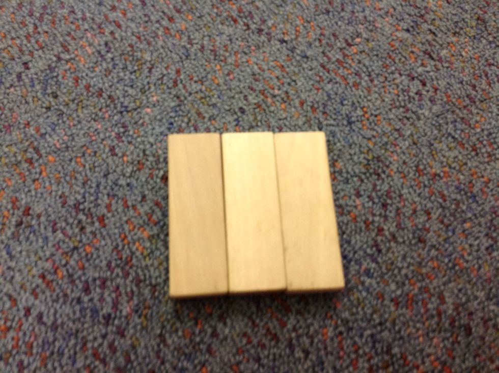 To start put three janga blocks on the bottom like the pitcher shows
