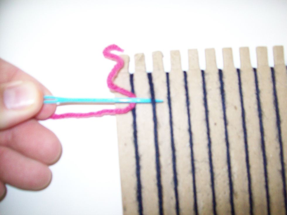 To start weaving, put the needle UNDER the 2nd warp.