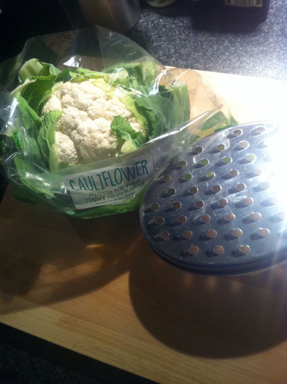 To start: You will need a whole cauliflower and cheese grater.