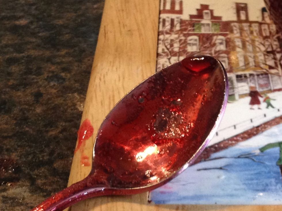 To test, dip a spoon in. If it wrinkles after 30 seconds it's ready.