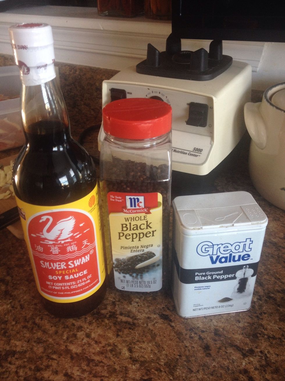 To the chicken add about 1/4 cup soy sauce (note the Filipino brand Silver Swan here - I swear it makes a difference) a small handful of peppercorns and a heavy sprinkling of ground black pepper.