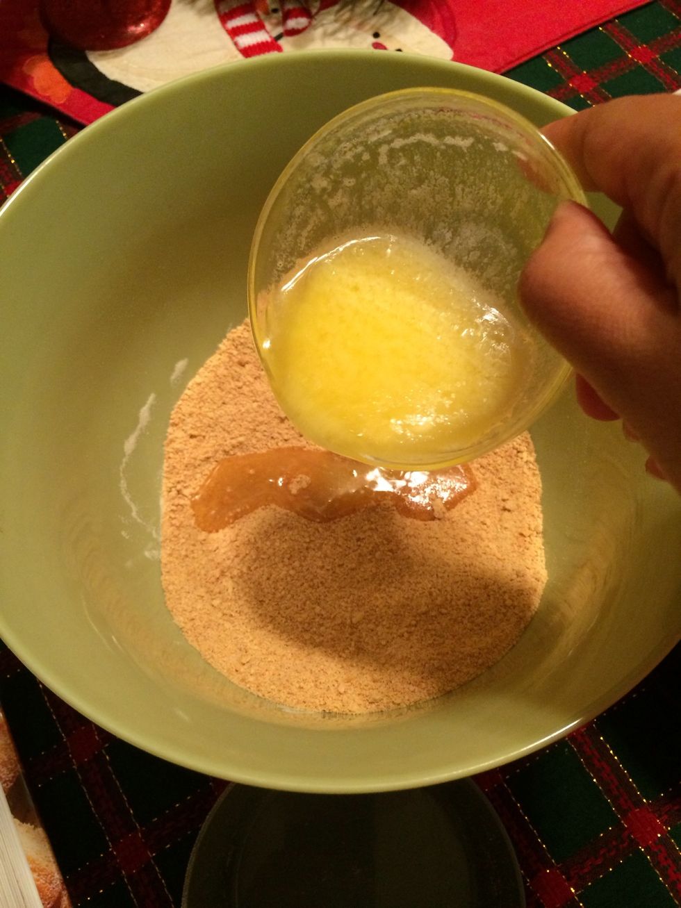 To the crumbs add the melted butter