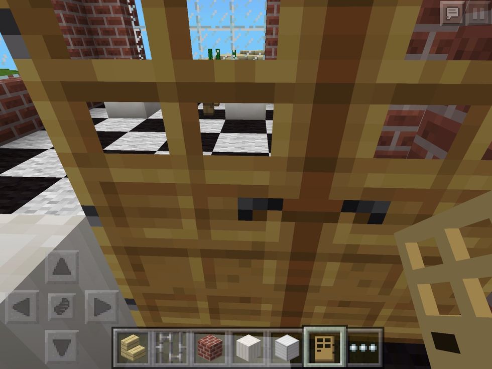 To the far left, much like the fridge, stand in the gap and build two doors. (A little complicated, might take a few tries!)