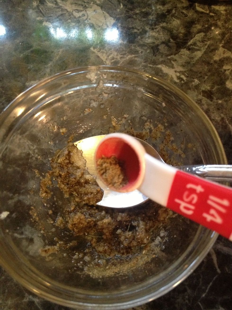 To the garlic paste add the oregano. Mix