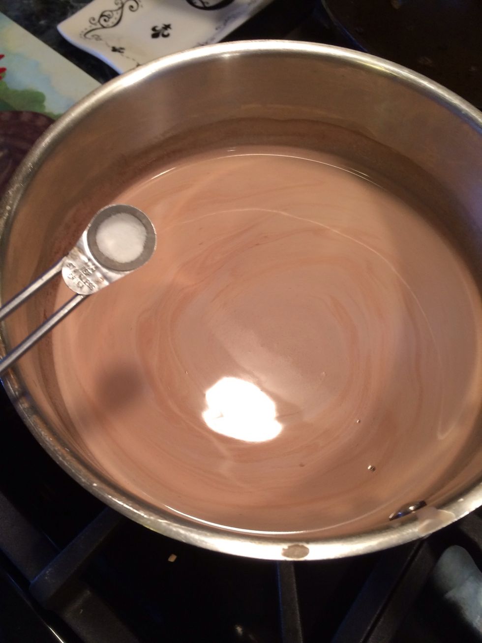 To the hot chocolate that is in the stovetop add the salt