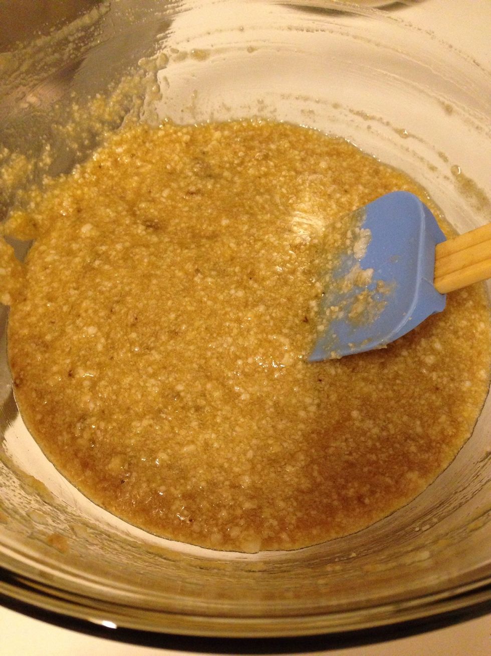 To the mashed bananas, whisk in the coconut oil, then brown sugar, egg, and vanilla extract. (My bananas were cold, so the coconut oil hardened slightly, causing the small lumps- this is okay!)