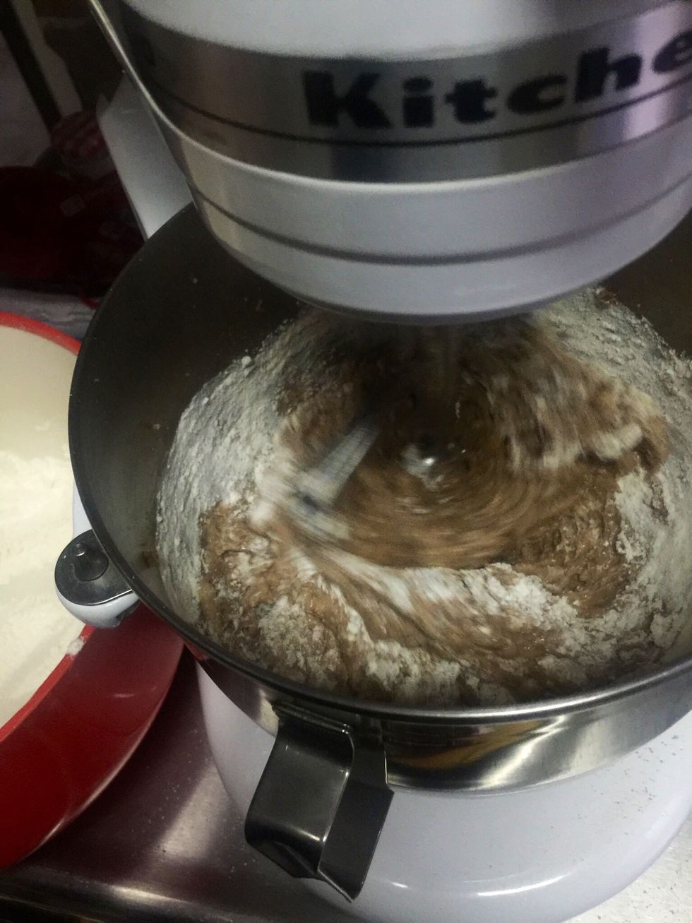 To the mixture start adding the flour in 3 parts.