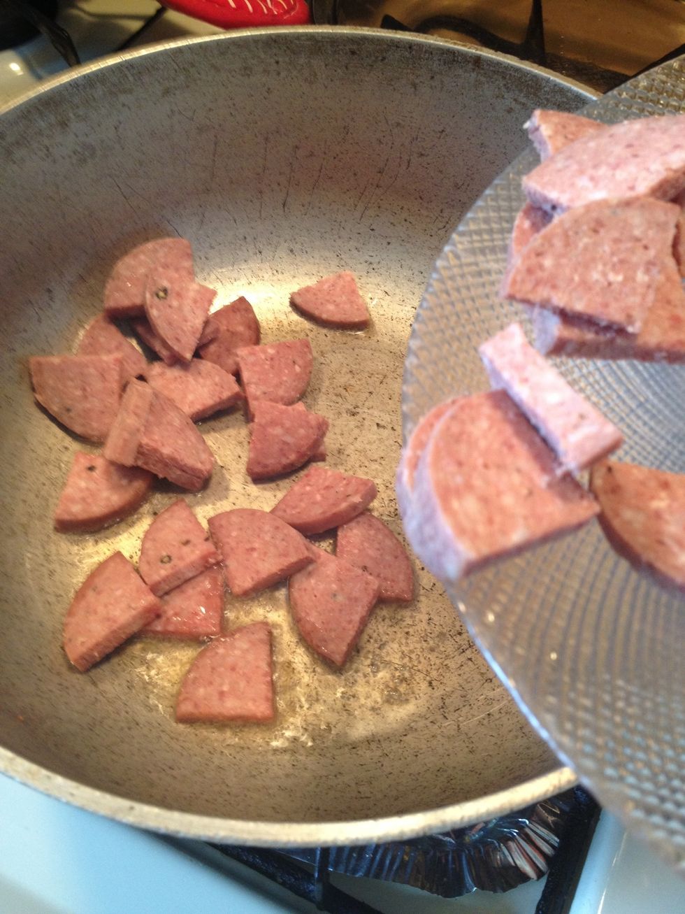 To the oil lets add the salami and cook until browned. Stirring frequently