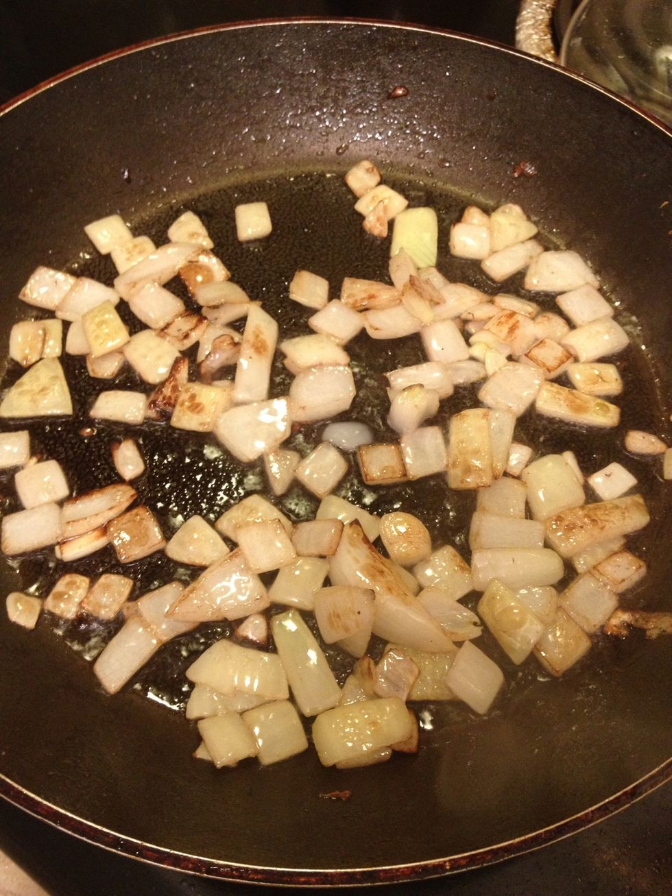 To the same pan, add another tbsp of coconut oil and saut\u00e9 your onion until browned on edges.