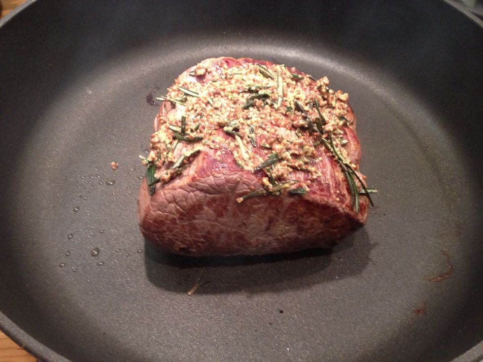 To the top add a mixture of grain mustard, chopped rosemary, crushed garlic and seasoning