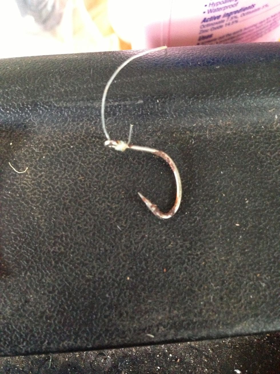 To tie a fish hook, you need to tie the hook so the fish won't come off. In this tutorial, I will be using thread so it will be easier to see. The hook is attached to the leader line, not the reel.