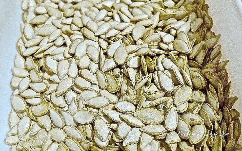 To toast pumpkin seeds, first remove seeds from the pumpkin. Clean and rinse them in a coriander.