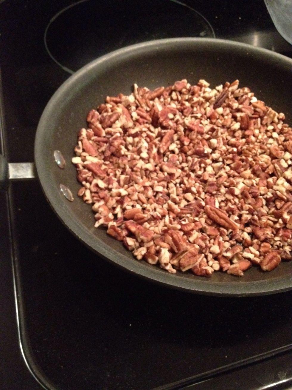 Toast pecan pieces over medium high heat, seasoning with popcorn/nut salt to taste. Preheat oven to 350 degrees.