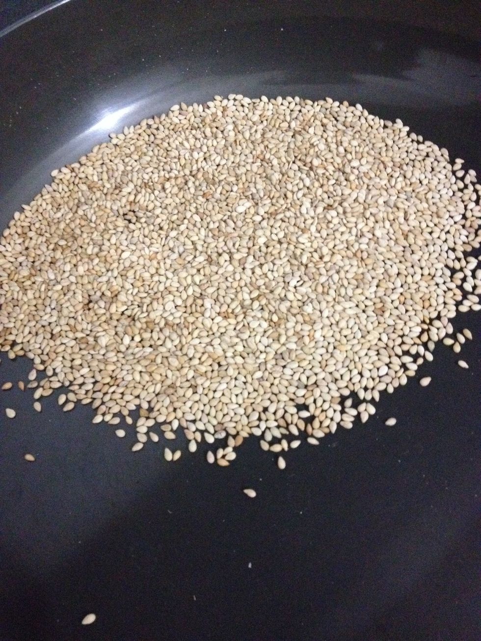 Toast some sesame seeds to be added to the mix . Toast them till they just start poping.