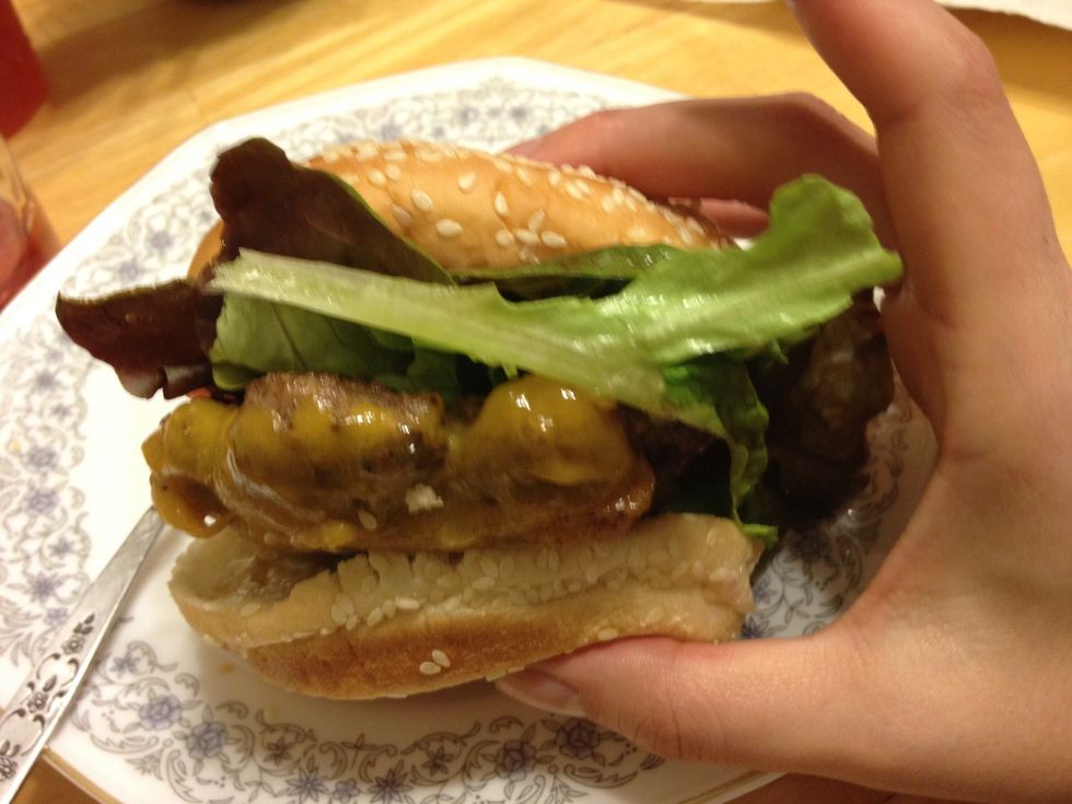 Toast the buns with a little butter and garlic power on the stove/grill for a minute or two on each side. Yum! Now you can eat the Delicious Burgers!