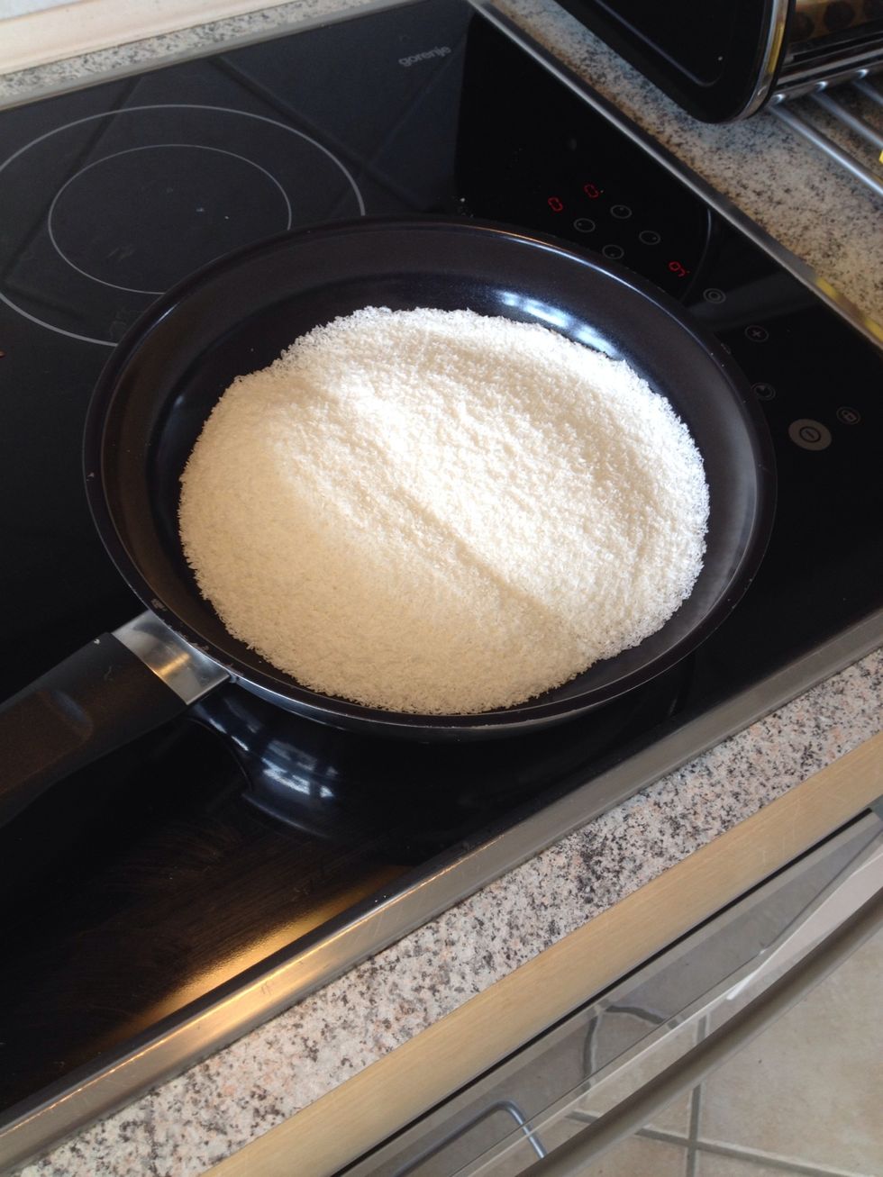 Toast the coconut flour golden on a dry pan