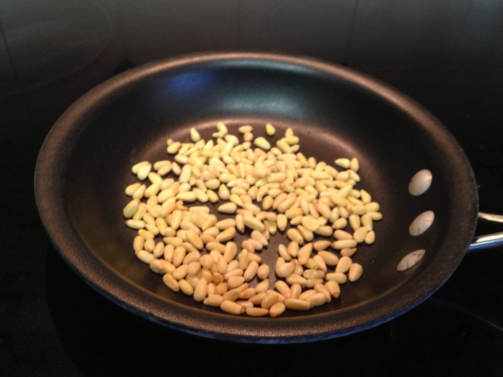 Toast the pine nuts in a dry nonstick pan over medium-low heat. This takes some time but they'll go from not done to oh crap! Very quickly. I toasted them while I was doing other stuff, tossing a lot.