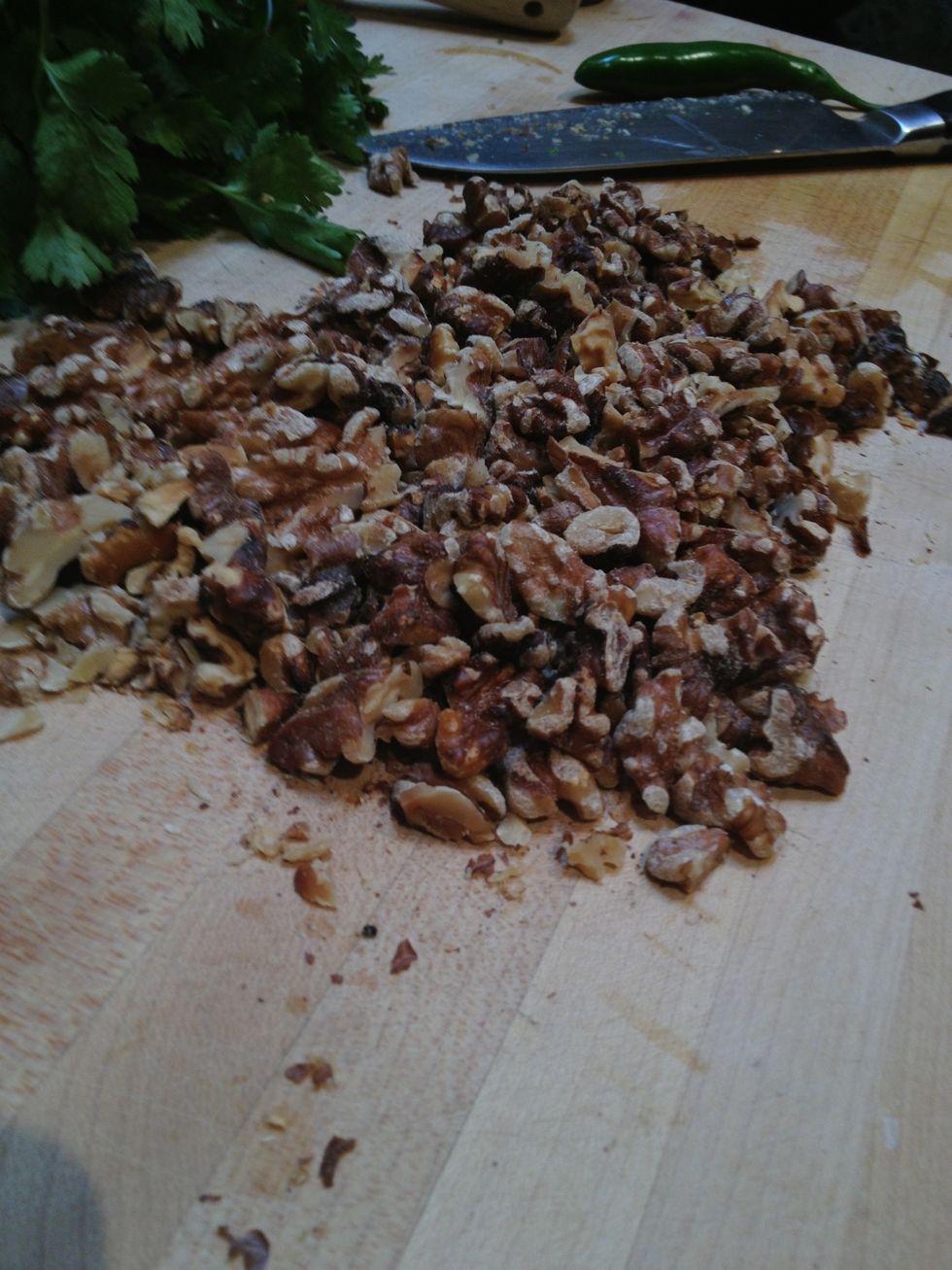 Toast the walnuts in the oven, then roughly chop.